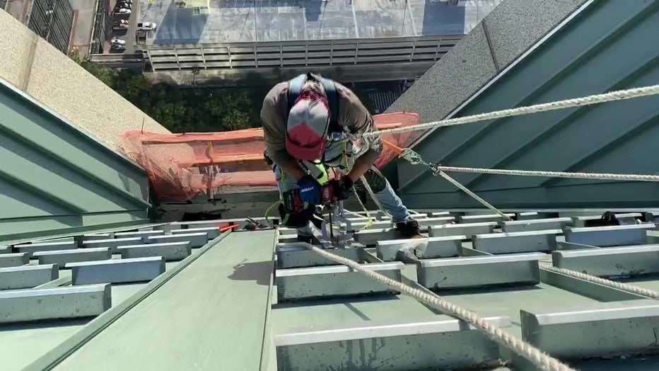 cedar park Roofer on side of building